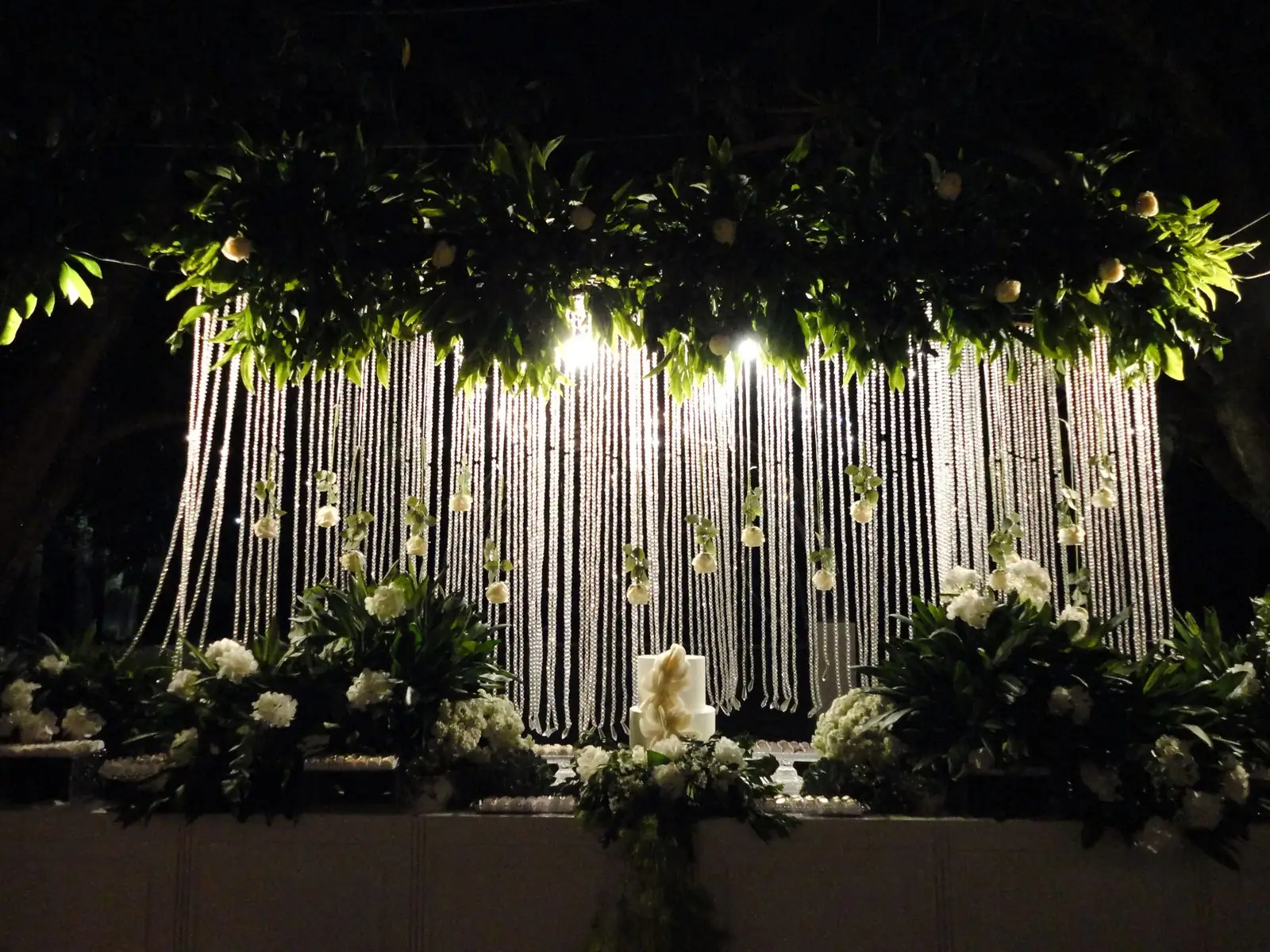 Wedding backdrop at night with flowers